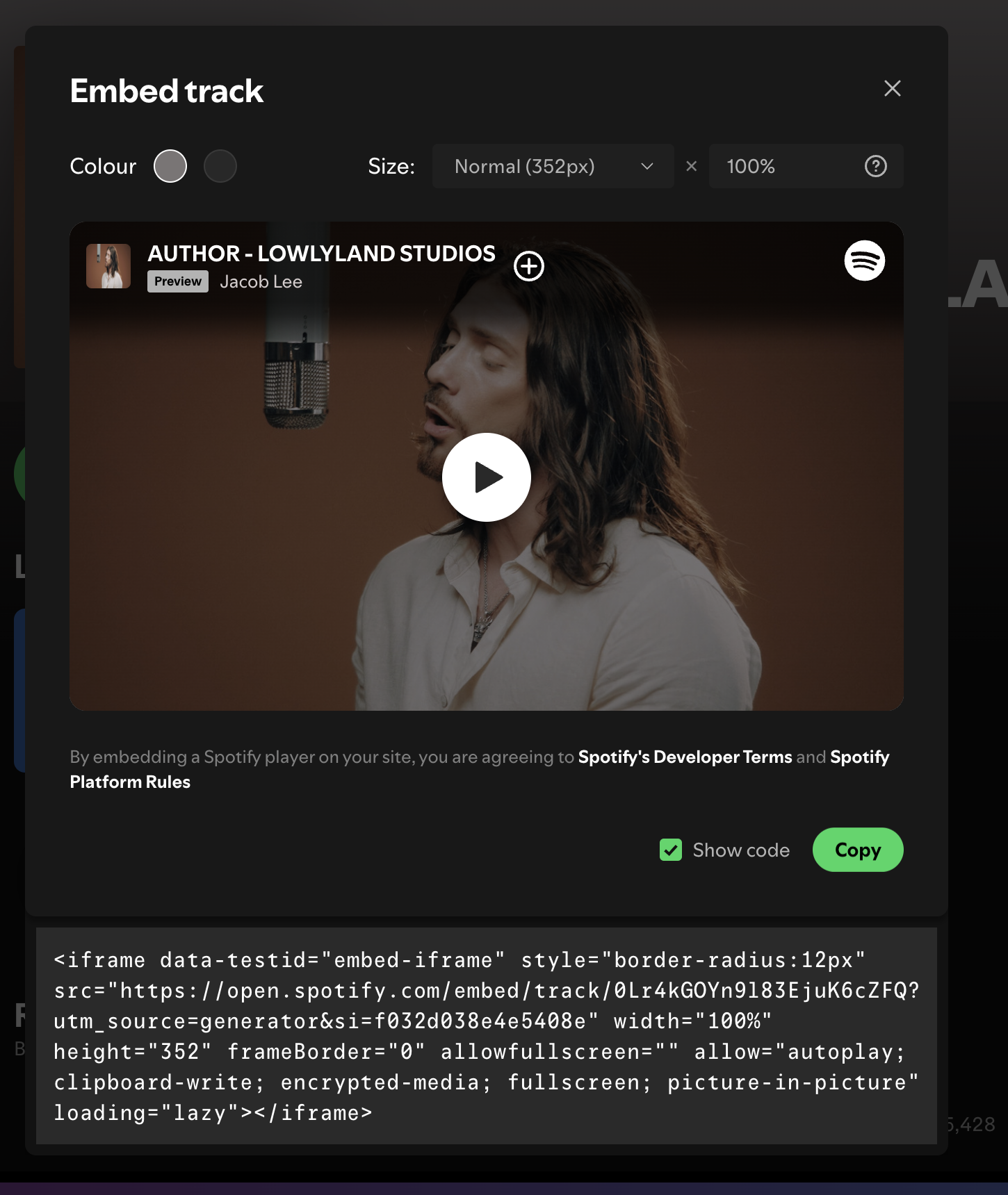 The Embed track dialog with Show code enabled, displaying the generated iframe HTML.